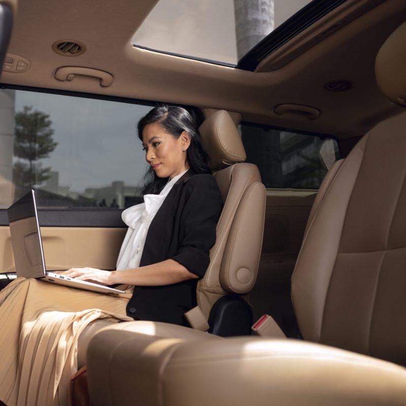 businesswoman-sitting-backseat-taxi